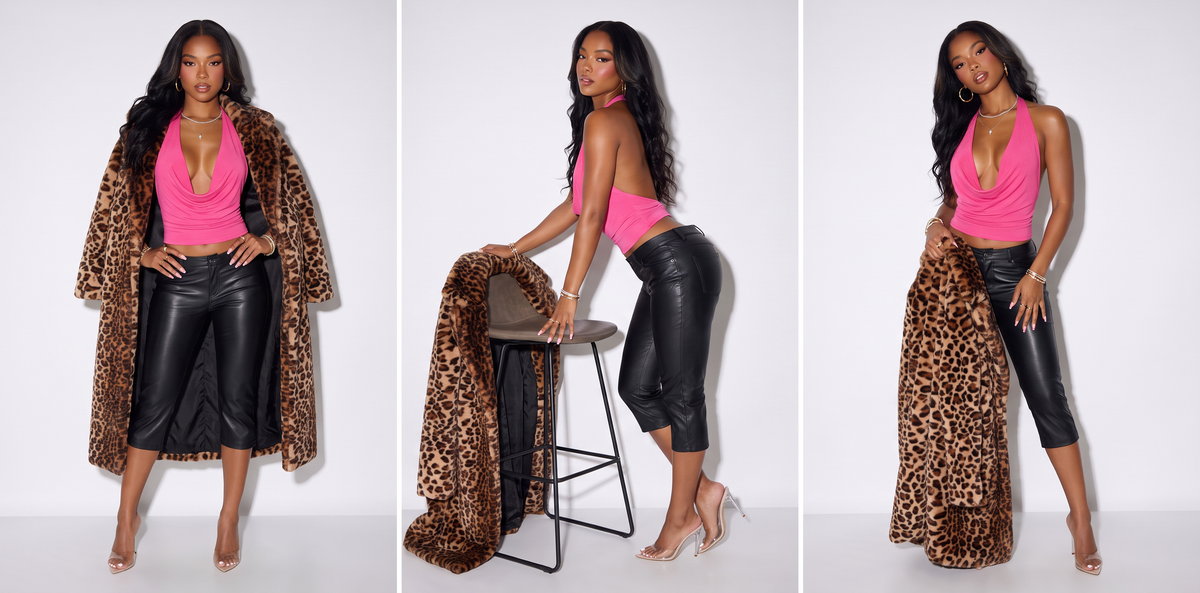 A model stands inside a metallic elevator lobby wearing a leopard-print coat over a white halter top and a shiny red faux leather mini skirt, paired with black heels.