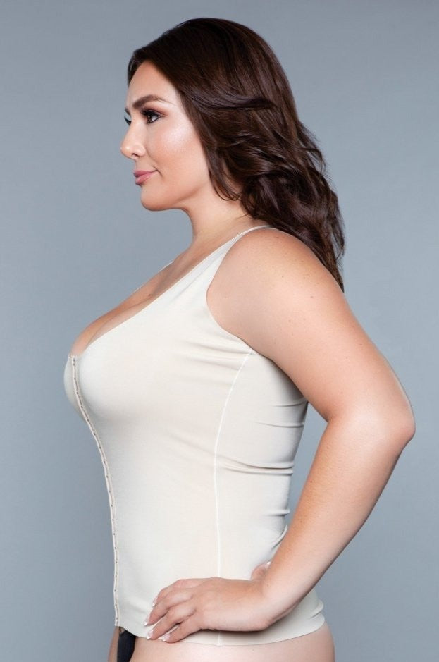 Smoothing waist-sculpting shapewear tank top in nude, featuring a low scoop neckline and front hook-and-eye closure.