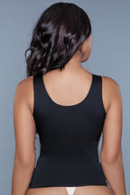 Black smoothing and waist-sculpting shapewear tank top with wide straps and a low scoop neckline, hugging the body closely.