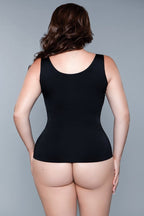 Black smoothing and waist-sculpting shapewear tank top with wide straps, low scoop neck, and seamless fit, worn by a model.