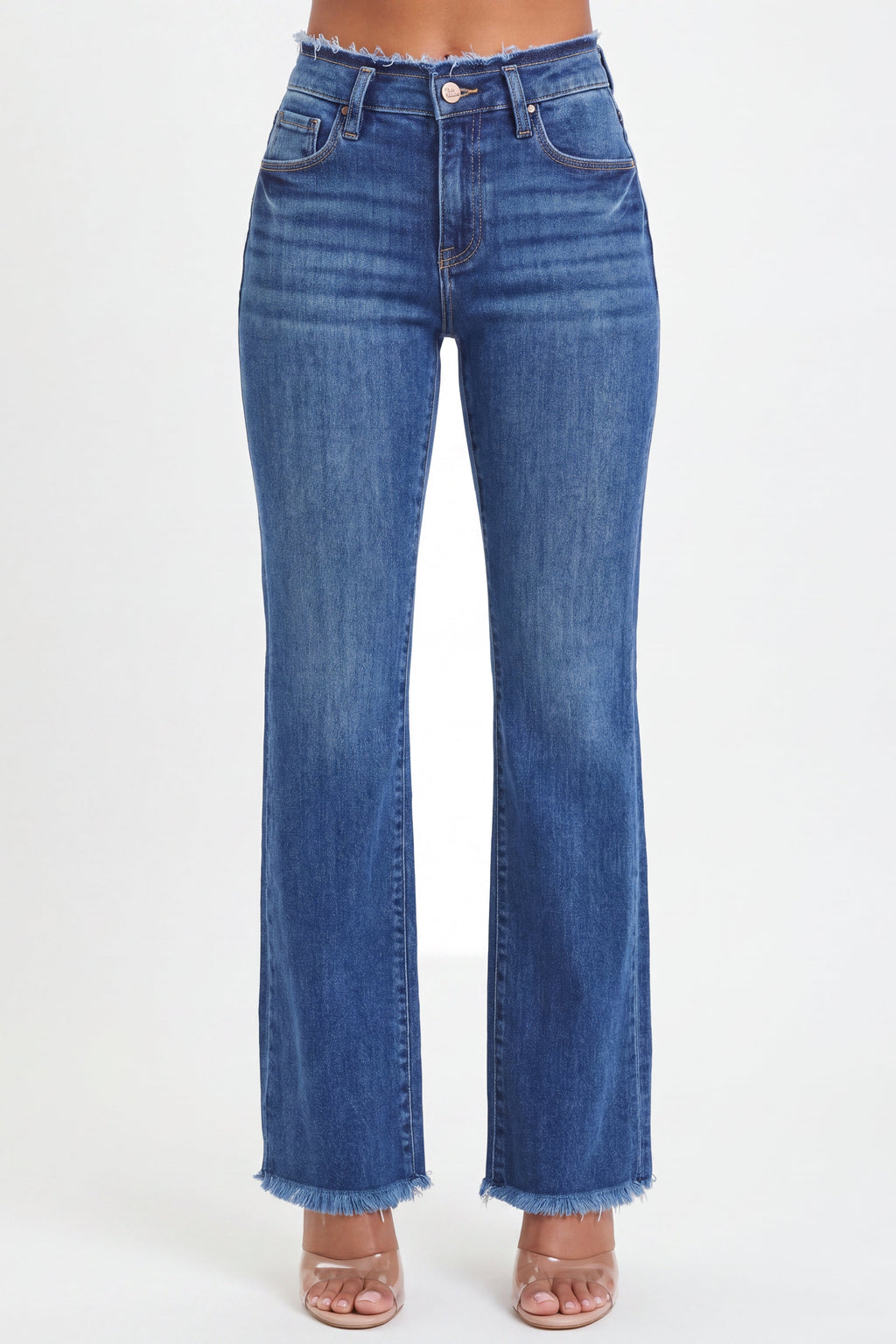 A person wearing medium-wash blue denim jeans with a frayed hem, shown from the waist down against a plain light background.