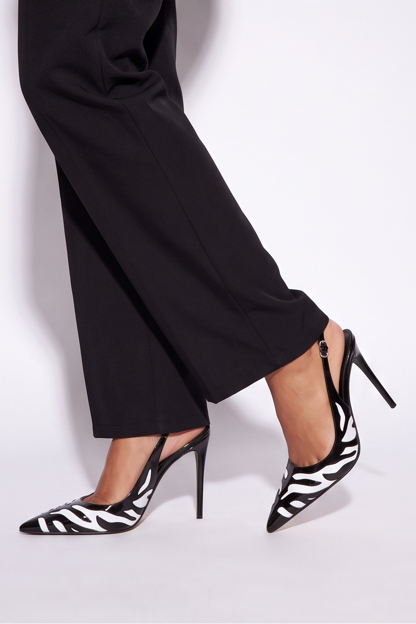 Bold zebra print patent stiletto slingback pumps in black and white, featuring a pointed toe and 4.3" slim heel.