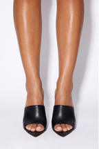 Black pointed toe stiletto high heel mules with a slip-on design, showcasing an open toe and single-band upper.
